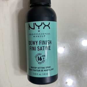 Nyx dewy finish makeup setting spray